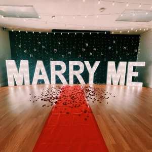 “MARRY ME” marquee setup for outdoor proposal