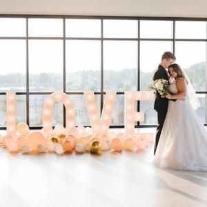 “LOVE” marquee sign at wedding